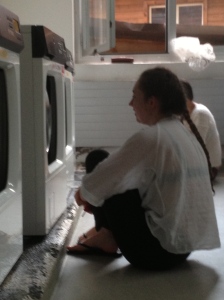 Jess urging the temperamental washing machine to just stop already! 
